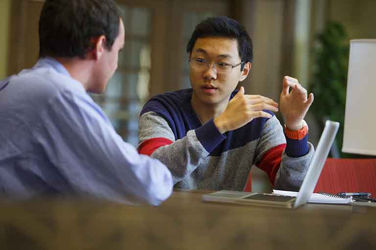 Students at table talking