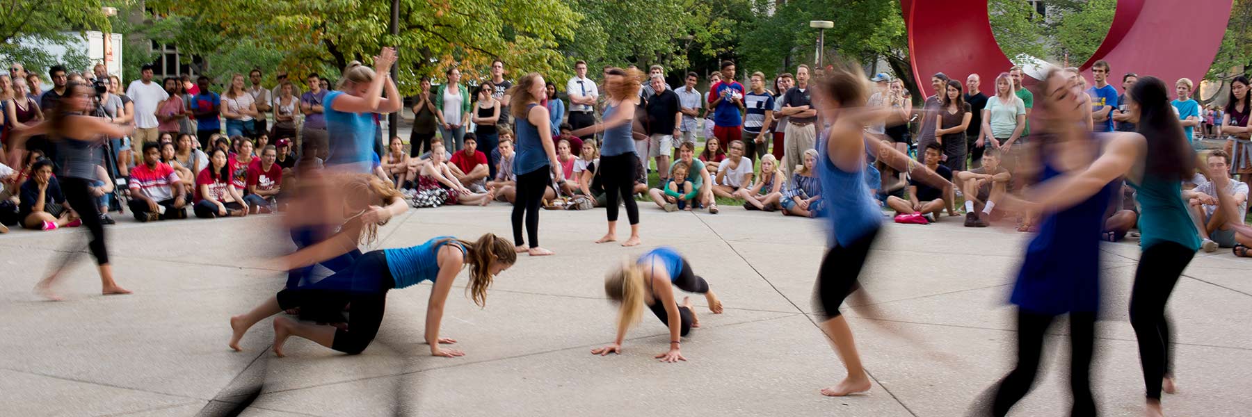 Students dancing in front of a crowd