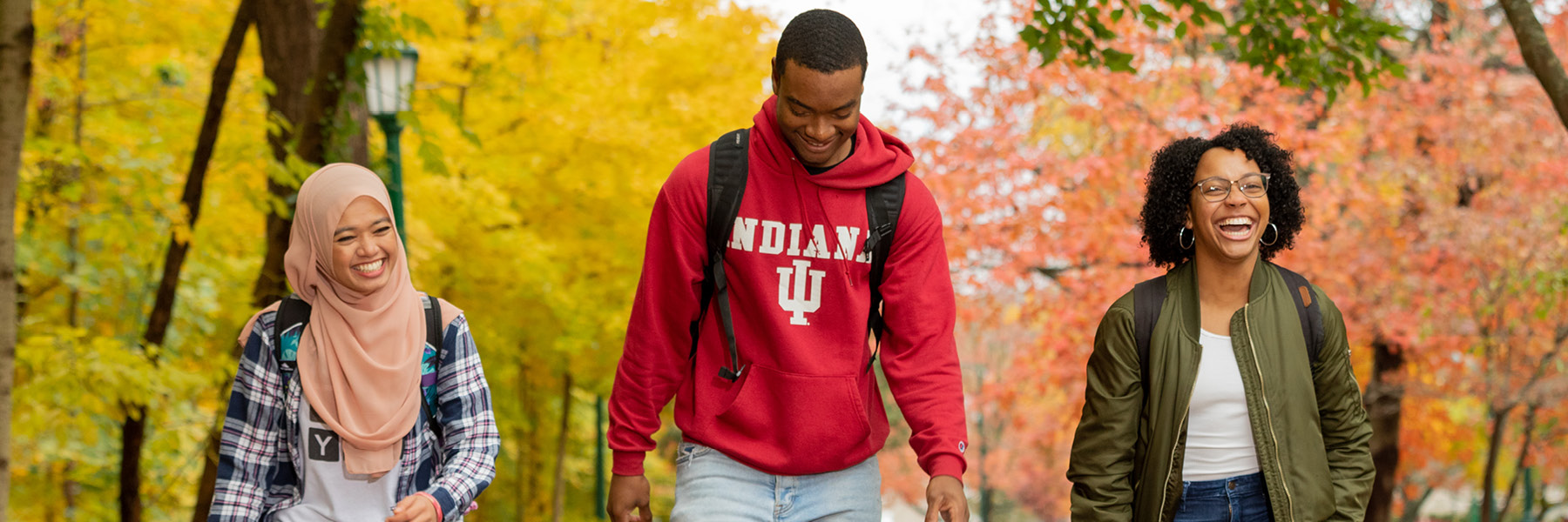 IU students walking together in the fall season.